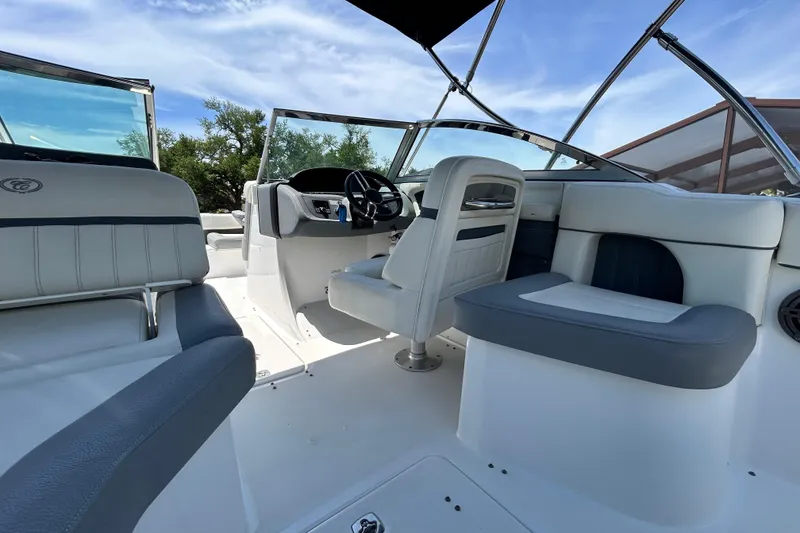 Slide: The Image of 2020 Cobalt 23SC boat interior with sleek seating and modern steering console. - 29