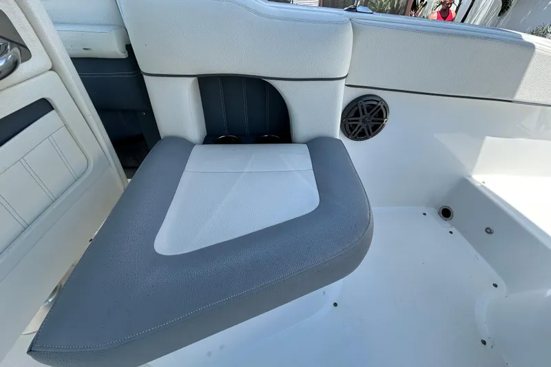 Slide: The Image of Interior seating of a 2020 Cobalt 23SC boat, featuring gray and white upholstery. - 31