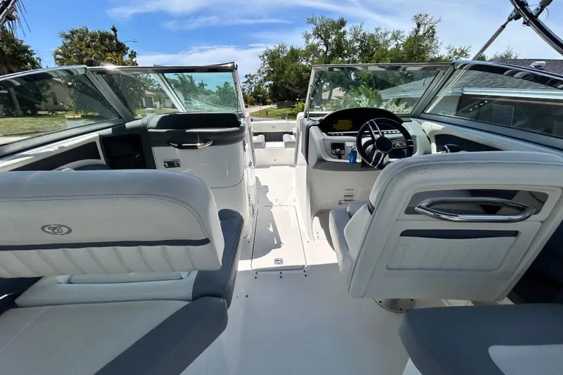 Slide: The Image of Interior view of a 2020 Cobalt 23SC boat, featuring sleek seating and modern controls. - 33