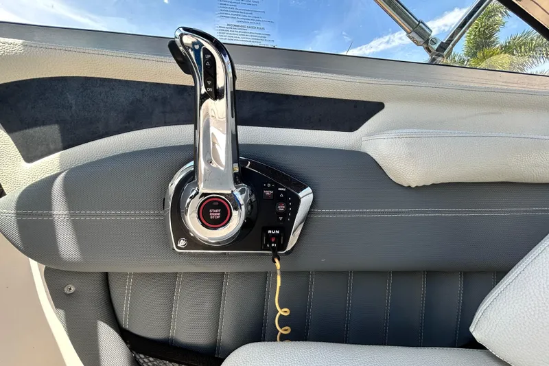 Slide: The Image of Throttle control panel of a 2020 Cobalt 23SC boat with start-stop button. - 37