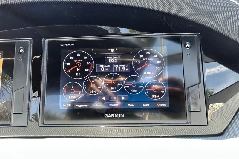 Slide: The Image of Garmin GPS display on 2020 Cobalt 23SC boat dashboard showing engine metrics. - 44
