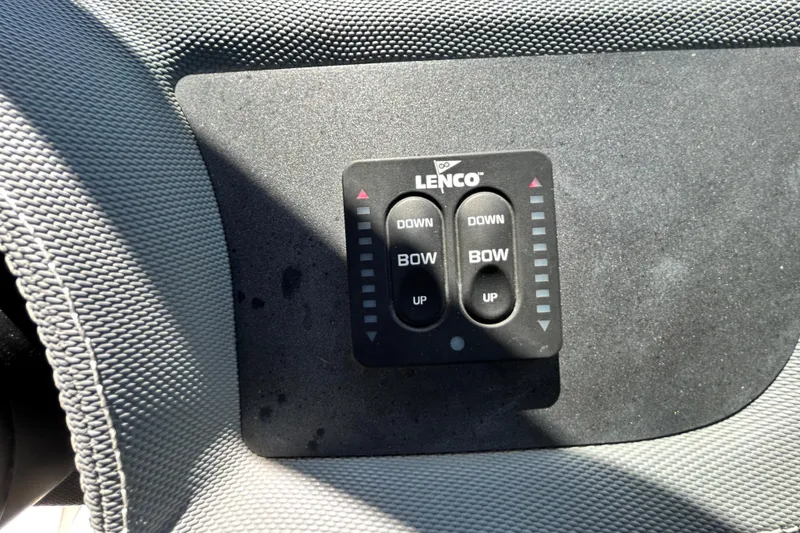 Slide: The Image of Lenco trim tab control panel on 2020 Cobalt 23SC boat dashboard. - 48