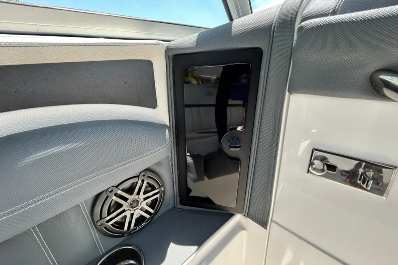 Slide: The Image of Interior of 2020 Cobalt 23SC boat featuring speaker and sleek design elements. - 54