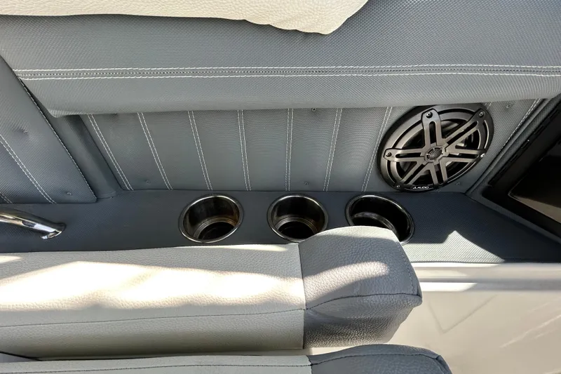 Slide: The Image of Interior of 2020 Cobalt 23SC boat with cup holders and speaker. - 56