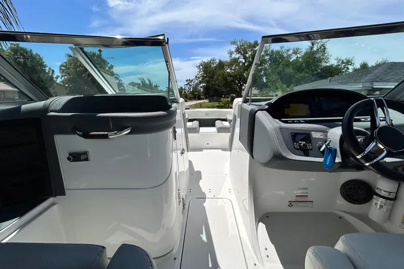 Slide: The Image of Interior view of a 2020 Cobalt 23SC boat, featuring sleek design and modern controls. - 57