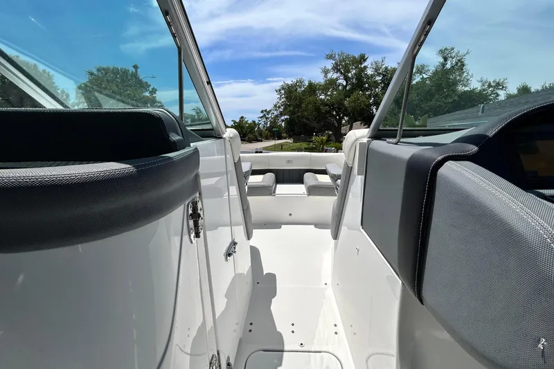 Slide: The Image of 2020 Cobalt 23SC boat interior with sleek design and comfortable seating. - 58