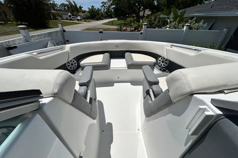 Slide: The Image of 2020 Cobalt 23SC boat interior with white seating and speakers. - 61