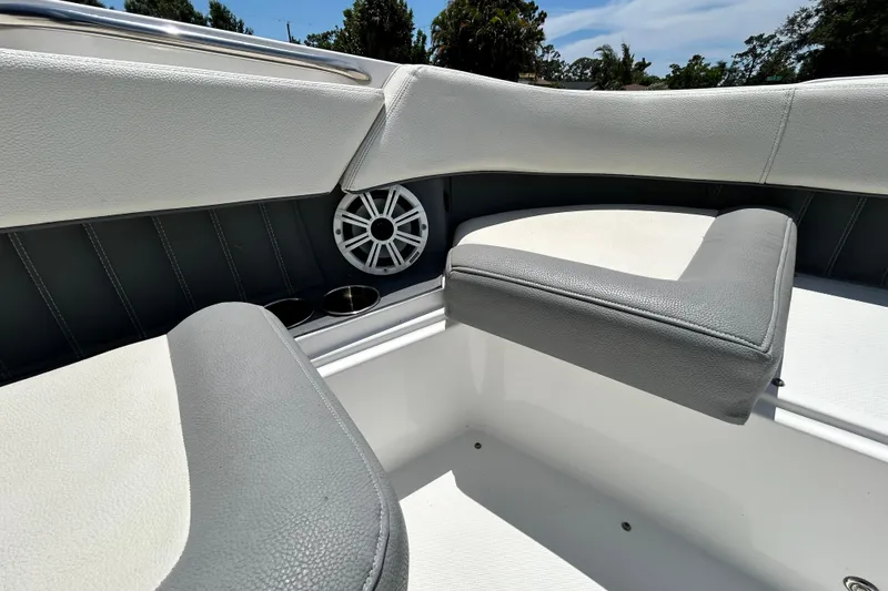 Slide: The Image of Interior seating of 2020 Cobalt 23SC boat with speaker and cup holders. - 65
