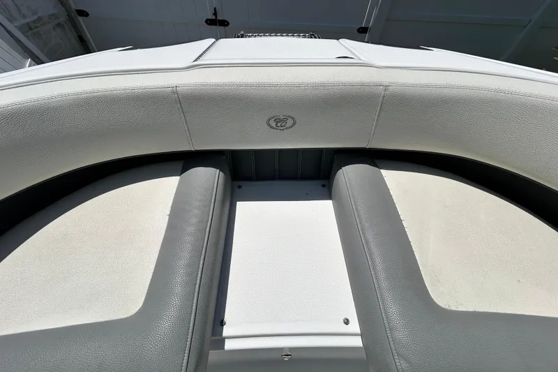 Slide: The Image of 2020 Cobalt 23SC boat interior with gray and white seating. - 73