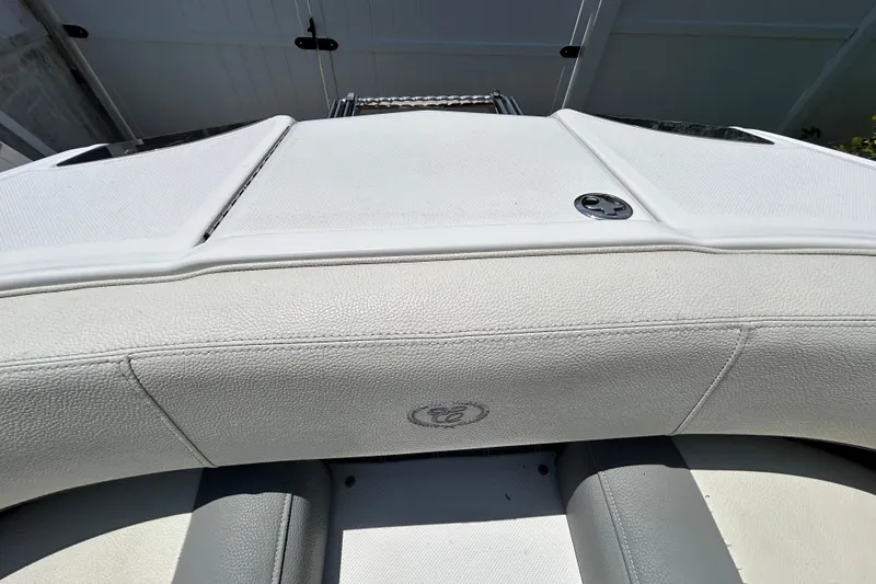 Slide: The Image of 2020 Cobalt 23SC boat interior with white upholstery and sleek design. - 74