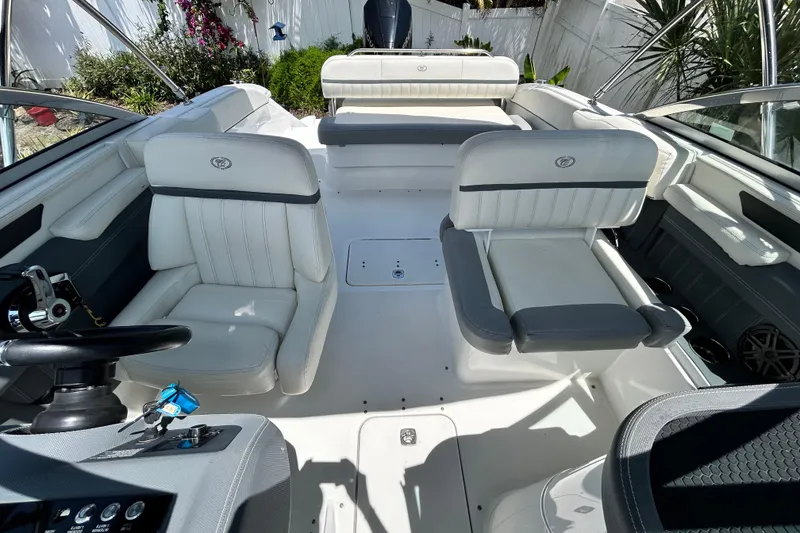 Slide: The Image of Interior of a 2020 Cobalt 23SC boat with white and gray seating. - 84