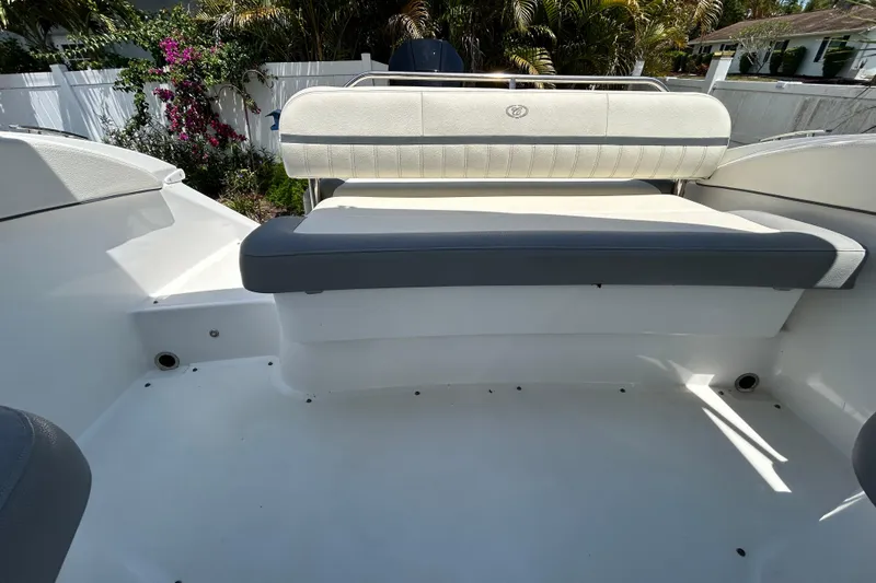 Slide: The Image of 2020 Cobalt 23SC boat interior with white and gray seating. - 93