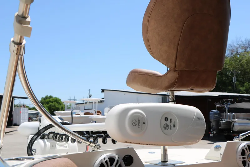 Slide: The Image of 2020 Stingray 192 SC boat seat and control panel in a sunny outdoor setting. - 12