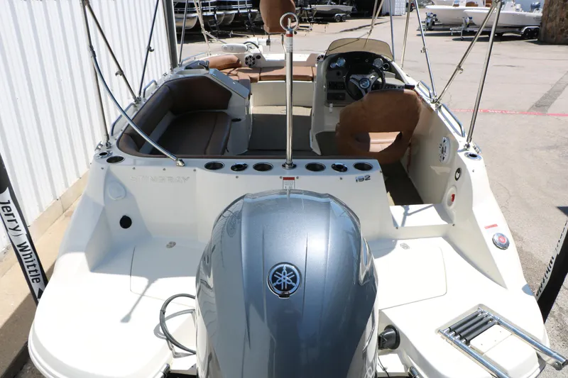 Slide: The Image of 2020 Stingray 192 SC boat with Yamaha engine, featuring spacious seating and modern controls. - 13