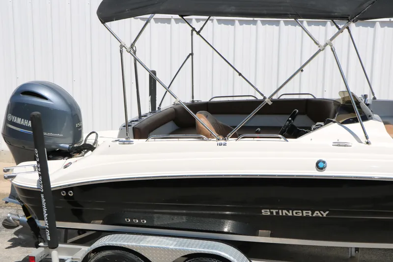 Slide: The Image of 2020 Stingray 192 SC boat with Yamaha outboard motor on trailer. - 18