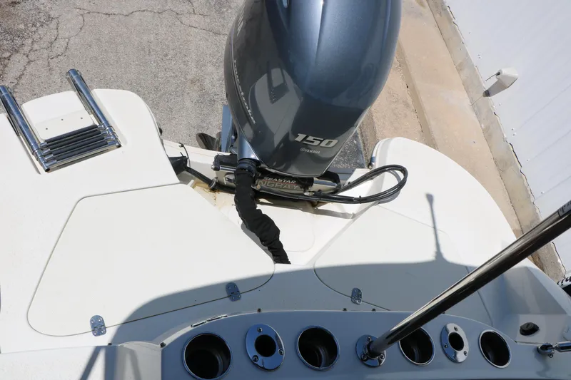 Slide: The Image of 2020 Stingray 192 SC boat with Yamaha 150 engine, featuring a sleek white deck design. - 27