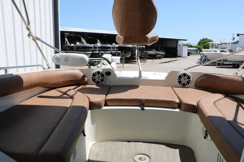Slide: The Image of 2020 Stingray 192 SC boat interior with brown seating and speaker system. - 32
