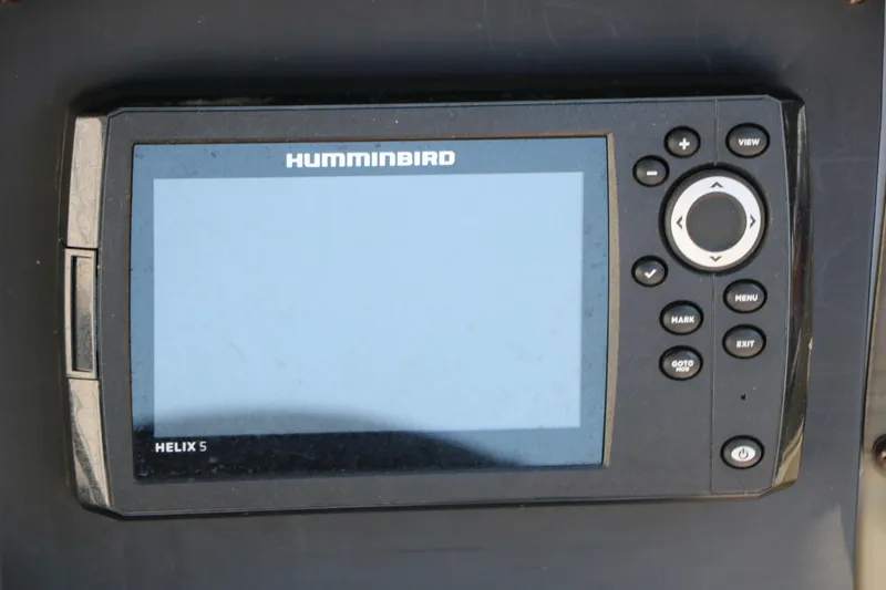 Slide: The Image of Humminbird Helix 5 fish finder on a 2020 Stingray 192 SC boat dashboard. - 38