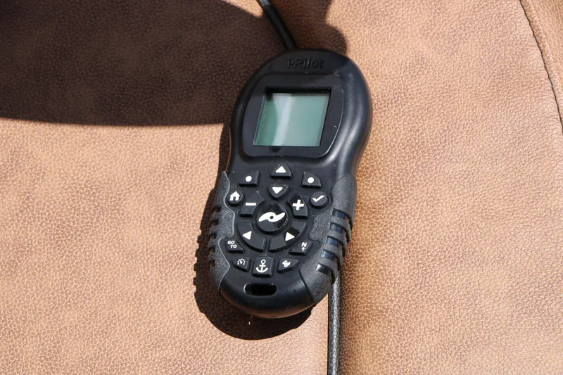 Slide: The Image of Remote control on brown leather seat, Stingray 192 SC, 2020 model. - 44
