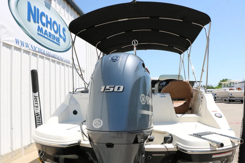 Slide: The Image of 2020 Stingray 192 SC boat with Yamaha 150 engine at Nichols Marine dealership. - 5