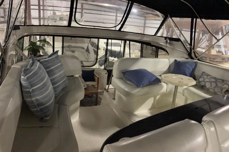 Slide: The Image of Interior of 2003 Silverton 43 Motor Yacht with cozy seating and decorative pillows. - 12