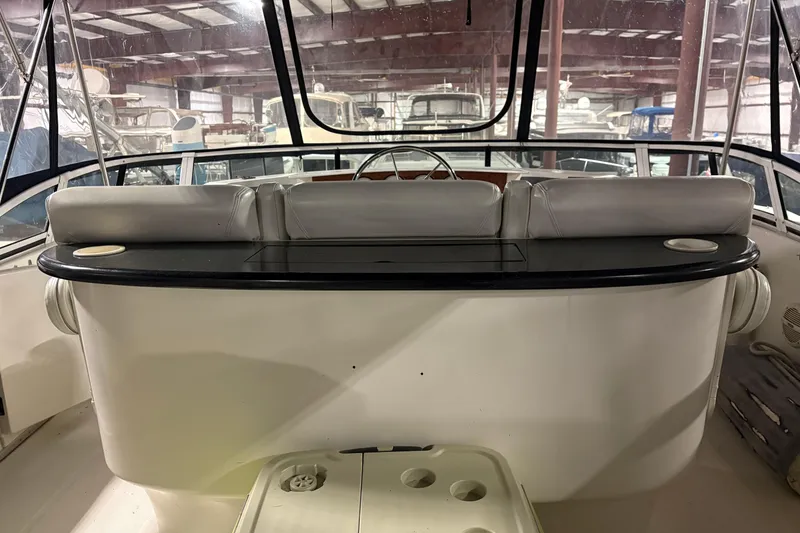 Slide: The Image of 2003 Silverton 43 Motor Yacht interior with helm and seating area. - 14