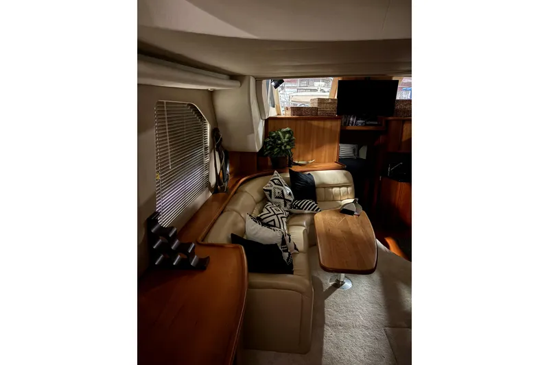 Slide: The Image of Interior of 2003 Silverton 43 Motor Yacht with cozy seating and modern decor. - 16