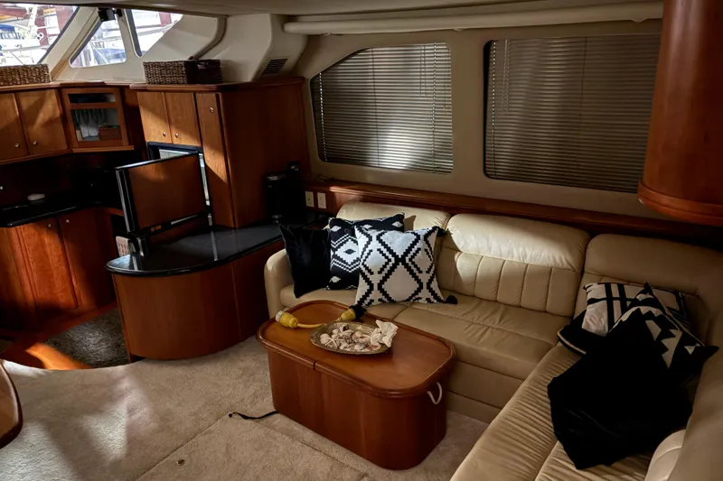 Slide: The Image of Luxurious interior of a 2003 Silverton 43 Motor Yacht with elegant seating and modern decor. - 17