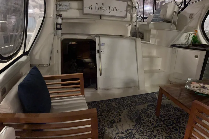 Slide: The Image of Interior of 2003 Silverton 43 Motor Yacht with cozy seating and nautical decor. - 6