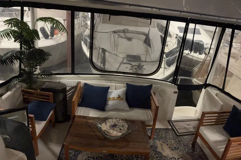 Slide: The Image of Luxurious interior of a 2003 Silverton 43 Motor Yacht with elegant seating and decor. - 7