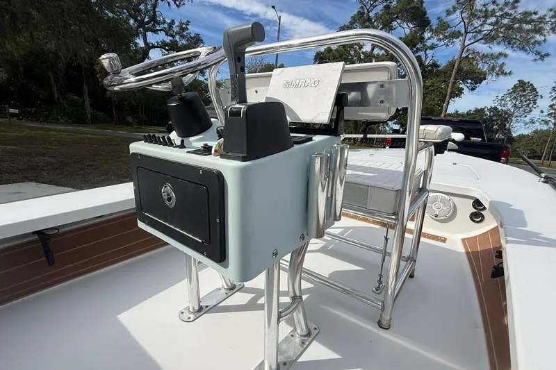 Slide: The Image of 2017 East Cape Vantage boat console with steering wheel and Simrad electronics. - 10