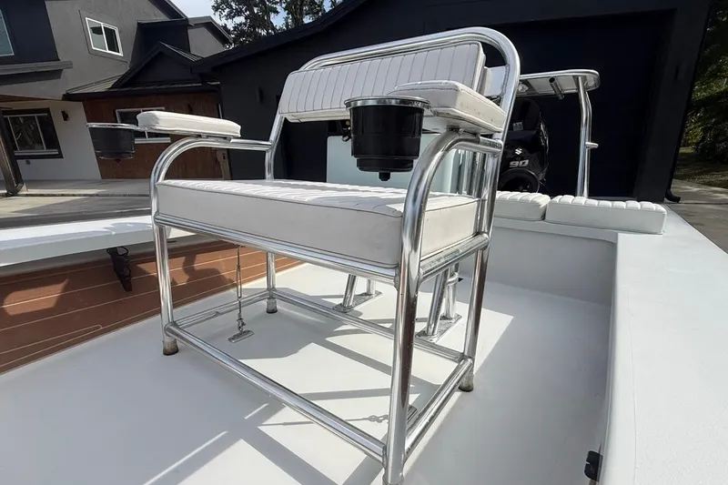 Slide: The Image of 2017 East Cape Vantage boat with white seating and stainless steel frame. - 12