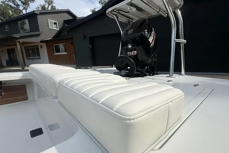 Slide: The Image of 2017 East Cape Vantage boat with Suzuki 90 engine and white cushioned seating. - 13