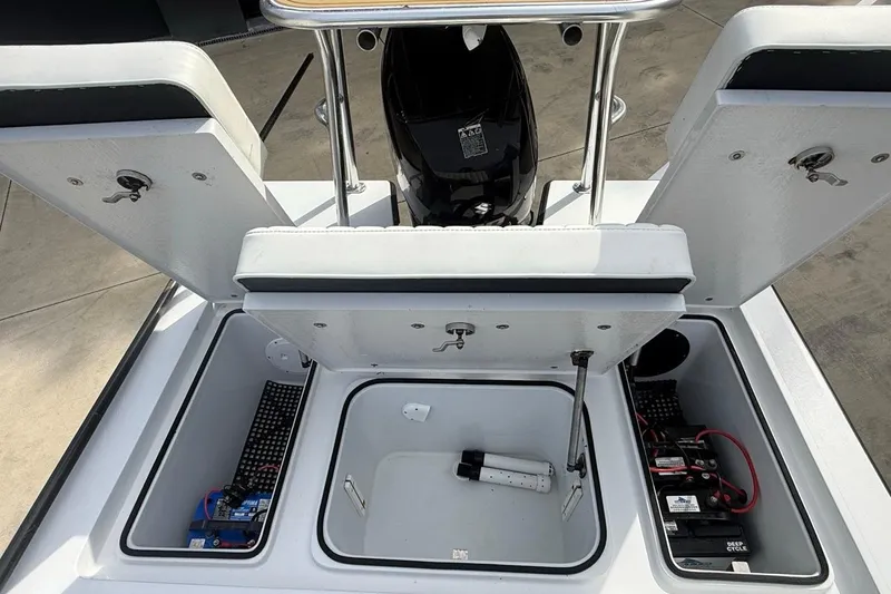Slide: The Image of 2017 East Cape Vantage boat storage compartments with batteries and equipment. - 15