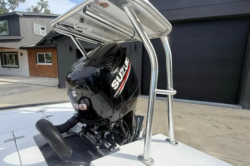 Slide: The Image of 2017 East Cape Vantage boat with Suzuki 90 outboard motor in driveway. - 16