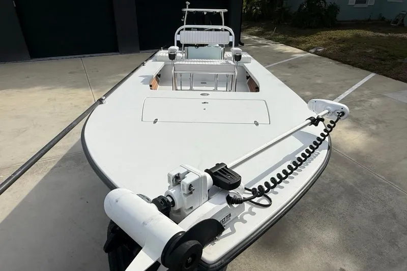 Slide: The Image of 2017 East Cape Vantage boat with trolling motor on concrete driveway. - 18