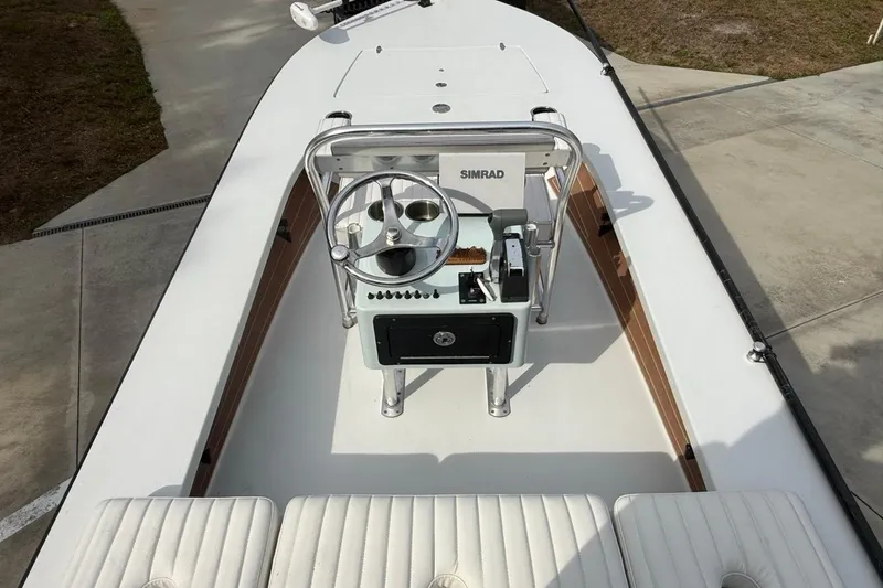 Slide: The Image of 2017 East Cape Vantage boat interior with steering console and Simrad navigation system. - 20