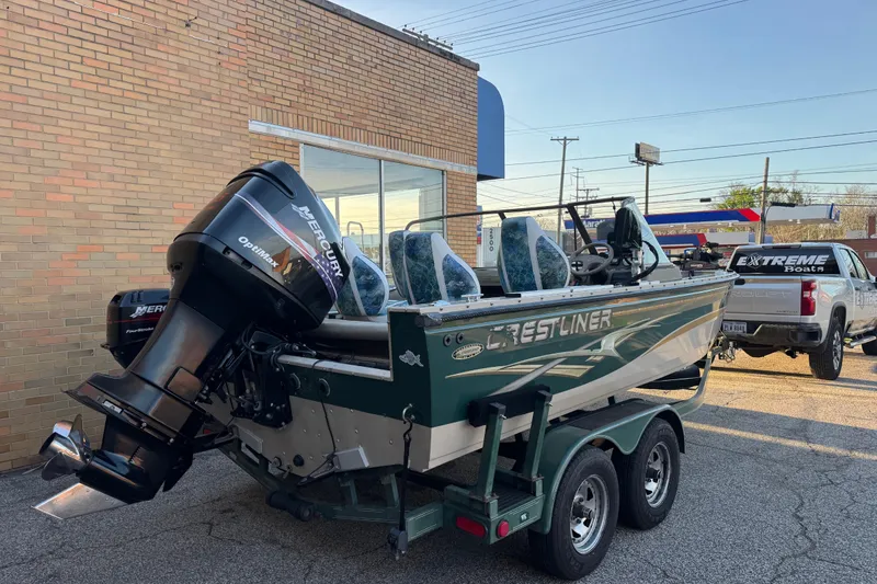 Slide: The Image of 2003 Crestliner 202 Tournament boat with Mercury Optimax engine on trailer. - 1