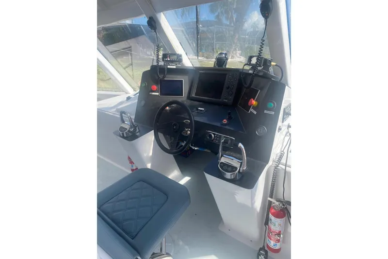 Slide: The Image of Cockpit of 2003 Gold Coast fast ferry with navigation controls and communication equipment. - 11