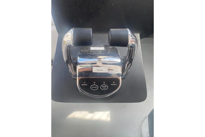 Slide: The Image of Chrome throttle control of a 2003 Gold Coast fast ferry, featuring dual levers and control buttons. - 15