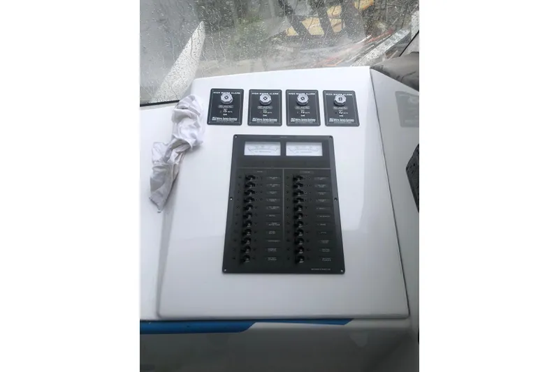 Slide: The Image of Control panel of a 2003 Gold Coast fast ferry with switches and meters. - 18