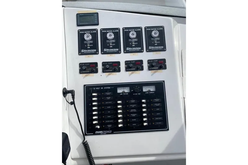 Slide: The Image of Control panel of a 2003 Gold Coast fast ferry with high water alarms and bilge pump switches. - 20