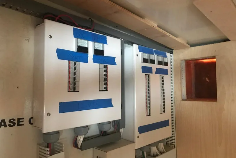 Slide: The Image of Electrical panels inside a 2003 Gold Coast fast ferry, featuring labeled circuit breakers. - 23