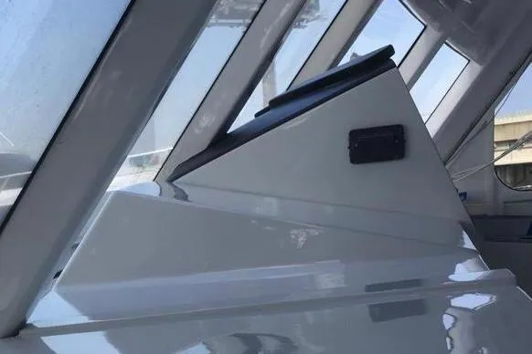 Slide: The Image of Interior view of a 2003 Gold Coast fast ferry cockpit with sleek design and modern controls. - 24