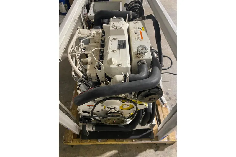 Slide: The Image of Engine of a 2003 Gold Coast fast ferry, showcasing mechanical components and hoses. - 30