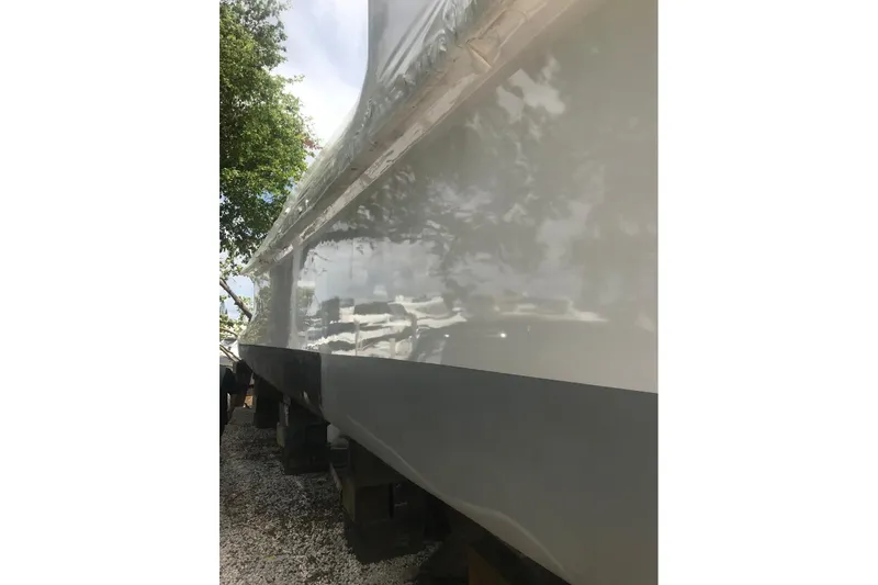 Slide: The Image of Side view of a 2003 Gold Coast fast ferry, showcasing its sleek hull design. - 32