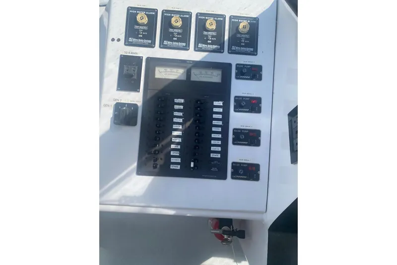 Slide: The Image of Control panel of a 2003 Gold Coast fast ferry with high water alarms and bilge pump switches. - 37