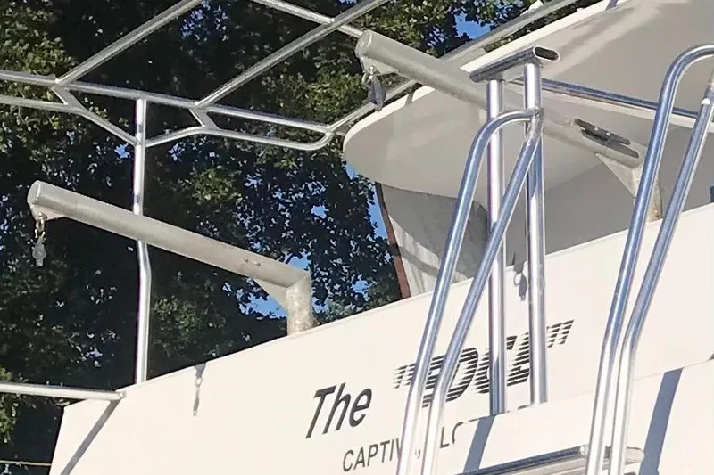 Slide: The Image of Close-up of a 2003 Gold Coast fast ferry with metal railings and partial name visible. - 4