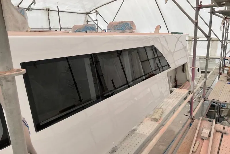 Slide: The Image of Gold Coast fast ferry under construction, 2003 model, with scaffolding and protective covering. - 40