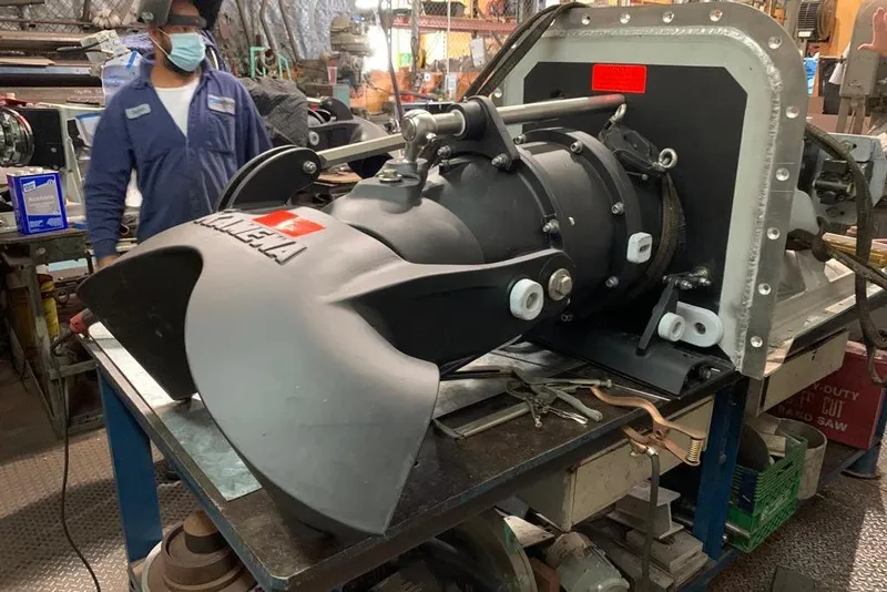 Slide: The Image of Mechanic inspecting a 2003 Gold Coast fast ferry engine component in a workshop. - 41